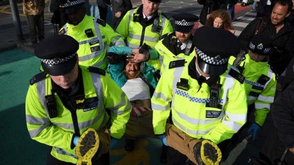 
                              Extinction Rebellion protester climbs on plane at London City Airport
                      