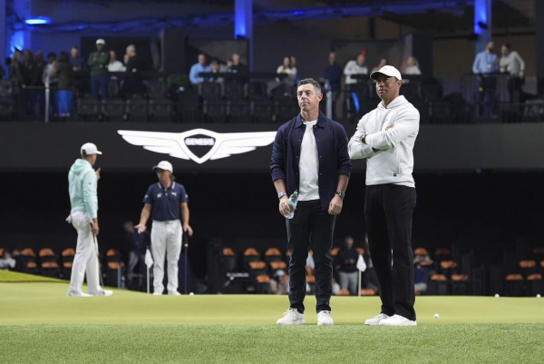 
      Tiger Woods and Rory McIlroy watch on as The Bay Golf Club wins opening match of high-tech indoor TGL golf league
    