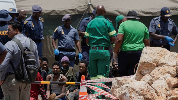 Dozens of bodies pulled from illegal South African mine - as 82 survivors face arrest Dozens of bodies pulled from illegal South African mine - as 82 survivors face arrest