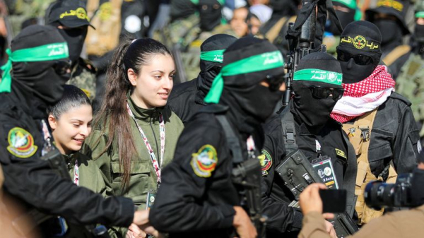 Four female soldiers reunite with families in Israel - as freed Palestinian prisoners carried by huge crowds in West Bank