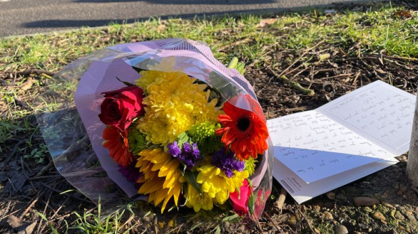 Flowers left at scene as community pays tribute to two children killed in hit-and-run crash